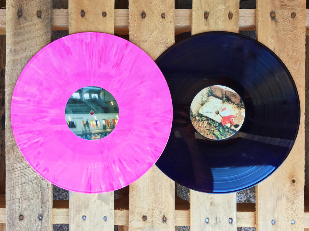 photograph of floral print mirror stages records tiny engines