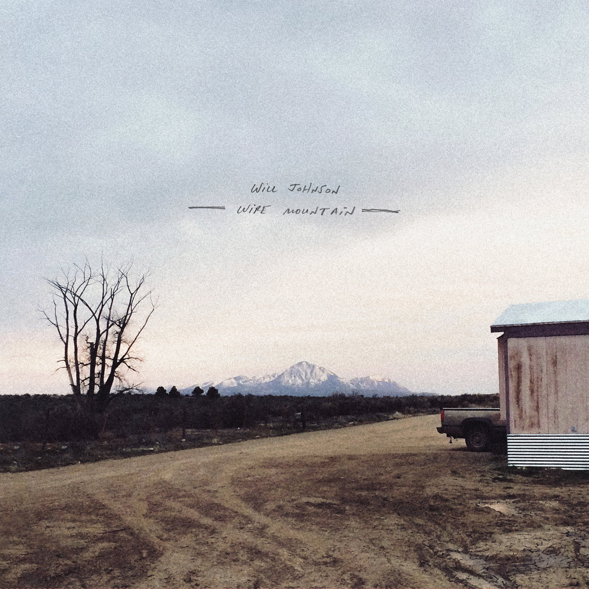 will johnson wire mountain album cover photo of desolate field and barn