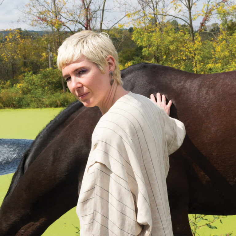 rosali no medium album cover, photo of rosali with short bleached blonde hair patting a horse
