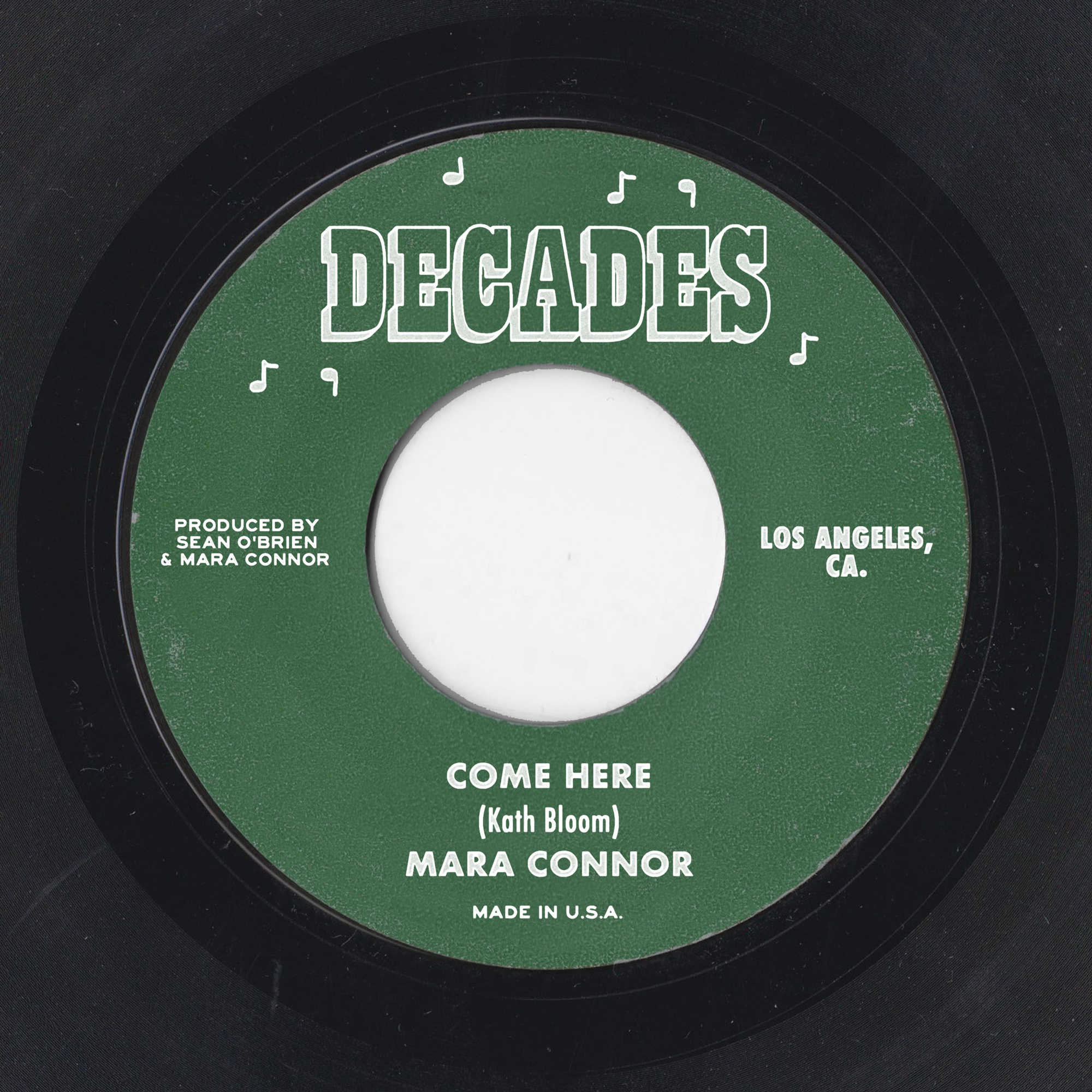 mara connor come here single artwork - mock up of a green LP label with white text that reads DECADES
