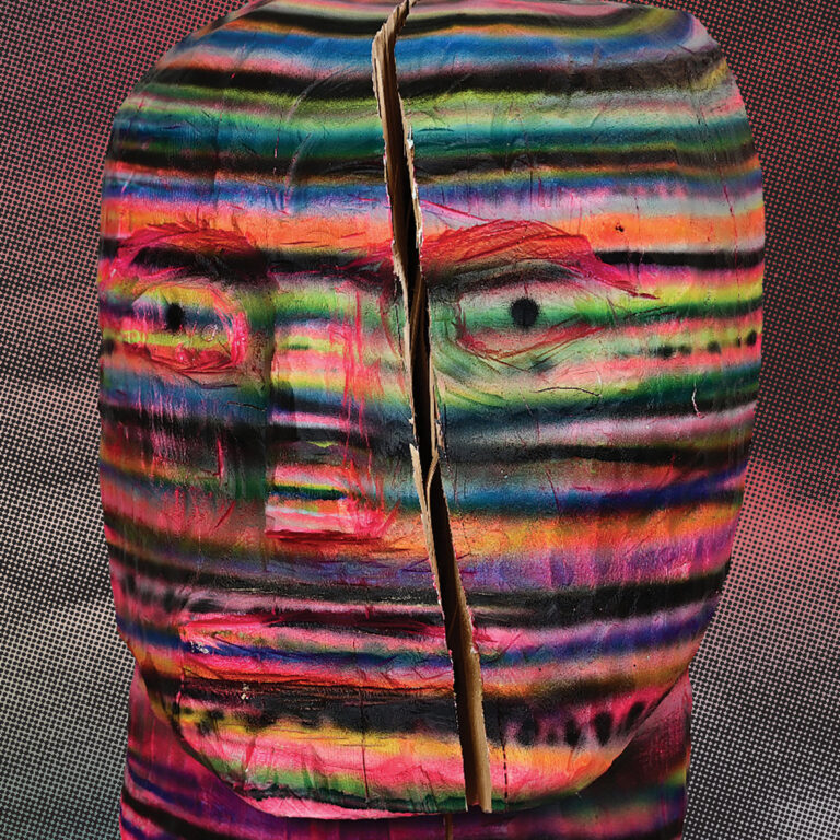earl vallie ghost approaches album art, head carved from wood and painted in multicoloured stripes