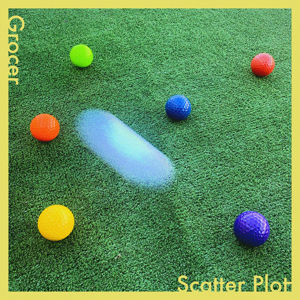 grocer scatter plot album art - colourful plastic golf balls on green astroturf