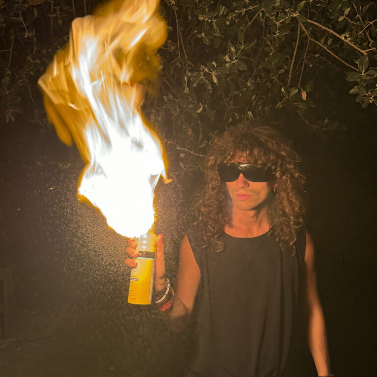 Silent Answers macgregor burns single artwork - photo of man spraying fire from an aerosol can